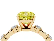 Fancy Yellow Cushion Cut Diamond Solitaire Ring Set in Yellow gold with Bezel Set Side Stones and Prong Setting