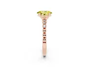 Fancy Yellow Oval Cut Diamond Solitaire Engagement Ring Set in Rose gold with Bezel Accents on Beaded Band