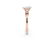 Three-Stone Oval Cut Diamond Ring Set in Rose gold with Prong Setting and Plain Band