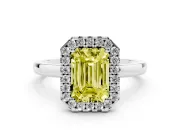 Fancy Yellow Emerald Cut Diamond Halo Solitaire Ring Set in White gold with Pavé Band and Prong Setting