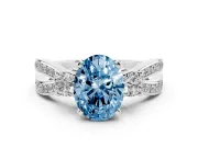 Fancy Blue Three-Stone Oval Cut Diamond Twist Band Ring Set in White gold with Pavé Accents and Prong Setting