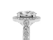 Oval Cut Diamond Milgrain Halo Solitaire Ring Set in White gold with Bezel Set Side Stones and Pavé Band
