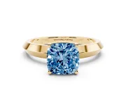 Fancy Blue Cushion Cut Diamond Solitaire Engagement Ring Set in Yellow gold with Flat Band and Prong Setting