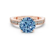 Fancy Blue Round Cut Diamond Solitaire Ring Set in Rose gold with Slim Pavé Band and Prong Setting