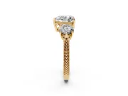 Heart Cut Diamond Three-Stone Ring Set in Yellow gold with Milgrain Band
