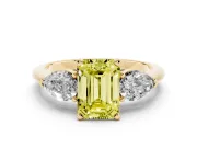 Fancy Yellow Three-Stone Emerald Cut Diamond Ring Set in Yellow gold with Pear Side Stones and Prong Setting