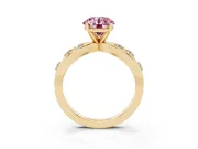 Fancy Pink Round Cut Diamond Solitaire Ring Set in Yellow gold with Side Stones on Criss-Cross Band and Prong Setting