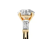 Round Cut Diamond Solitaire Ring Set in Yellow gold with Tapered Baguette Side Stones and Prong Setting