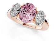 Fancy Pink Oval Cut Diamond Three-Stone Ring Set in Rose gold with Polished Band and Prong Setting
