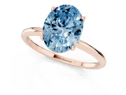 Fancy Blue Oval Cut Diamond Solitaire Engagement Ring Set in Rose gold with Thin Band and Prong Setting