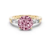 Fancy Pink Round Cut Diamond Solitaire Ring Set in Yellow gold with Tapered Baguette Side Stones and Prong Setting