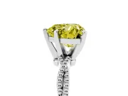 Fancy Yellow Heart Cut Diamond Solitaire Ring Set in Platinum with Twisted Band and Bead Prong Setting