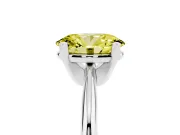 Fancy Yellow Oval Cut Diamond Solitaire Ring Set in Silver with Prong Setting on a Plain Round Band