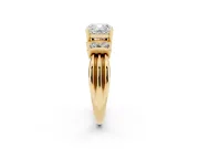 Three-Stone Cushion Cut Diamond Channel Set Ring Set in Yellow gold with Bar Prongs