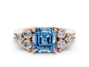 Fancy Blue Asscher Cut Diamond Solitaire Ring Set in Rose gold with Cluster Accents on Each Side