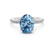 Fancy Blue Oval Cut Diamond Solitaire Ring Set in Silver with Round Pavé Band and Prong Setting