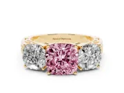 Fancy Pink Cushion Cut Diamond Three-Stone Ring Set in Yellow gold with Textured Band