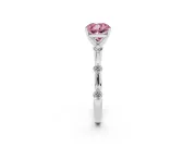 Fancy Pink Cushion Cut Diamond Solitaire Ring Set in Silver with Bezel Set Side Stones and Prong Setting