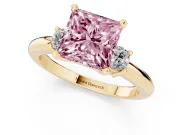 Fancy Pink Three-Stone Princess Cut Diamond Ring Set in Yellow gold with Prong Setting and Plain Band