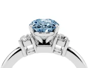 Fancy Blue Three-Stone Oval Cut Diamond Ring Set in Silver with Prong Setting and Plain Band
