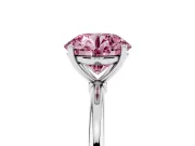Fancy Pink Round Cut Diamond Solitaire Engagement Ring Set in Platinum with Thin Band and Prong Setting