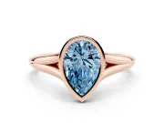 Fancy Blue Bezel Set Pear Cut Diamond Solitaire Ring Set in Rose gold with Tapered Band