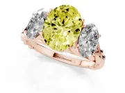 Fancy Yellow Oval Cut Diamond Three-Stone Ring Set in Rose gold with Braided Band