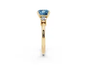 Fancy Blue Three-Stone Princess Cut Diamond Ring Set in Yellow gold with Prong Setting and Plain Band