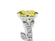 Fancy Yellow Oval Cut Diamond Solitaire Leaf-Inspired Ring Set in Platinum with Pavé Band and Prong Setting