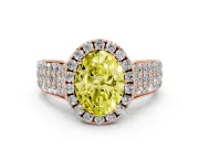 Fancy Yellow Oval Cut Diamond Halo Ring Set in Rose gold with Pavé Band and Raised Center Setting