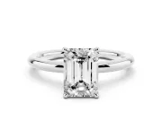 Emerald Cut Diamond Solitaire Ring Set in White gold with Thin Band and Prong Setting