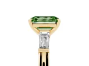 Fancy Green Emerald Cut Diamond Solitaire Ring Set in Yellow gold with Tapered Baguette Side Stones and Prong Setting