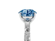 Fancy Blue Round Cut Diamond Solitaire Set in White gold with Side Baguettes and Channel Set Band