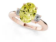 Fancy Yellow Three-Stone Oval Cut Diamond Ring Set in Rose gold with Prong Setting and Plain Band