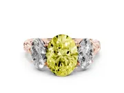Fancy Yellow Oval Cut Diamond Three-Stone Ring Set in Rose gold with Braided Band