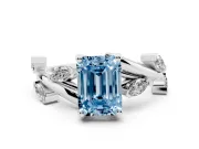 Fancy Blue Emerald Cut Diamond Solitaire Ring Set in White gold with Twisted Marquise Accent Band