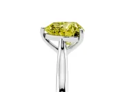 Fancy Yellow Heart Cut Diamond Solitaire Ring Set in White gold with Cathedral Band and Prong Setting