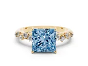 Fancy Blue Princess Cut Diamond Cluster Solitaire Ring Set in Yellow gold with Prong Setting