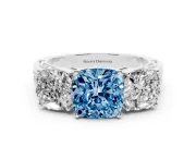 Fancy Blue Cushion Cut Diamond Three-Stone Ring Set in White gold with Textured Band