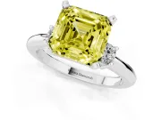 Fancy Yellow Three-Stone Asscher Cut Diamond Ring Set in Platinum with Prong Setting and Plain Band