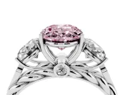 Fancy Pink Oval Cut Diamond Three-Stone Ring Set in Platinum with Braided Band