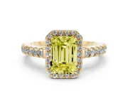 Fancy Yellow Emerald Cut Diamond Halo Engagement Ring Set in Yellow gold with Pavé Band and Prong Setting