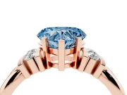 Fancy Blue Three-Stone Heart Cut Diamond Channel Set Ring Set in Rose gold with Bar Prongs