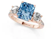 Fancy Blue Three-Stone Radiant Cut Diamond Pavé Band Ring Set in Rose gold with Prong-Set Trio