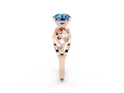 Fancy Blue Round Cut Diamond Solitaire Ring Set in Rose gold with Side Stones on Criss-Cross Band and Prong Setting