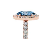 Fancy Blue Oval Cut Diamond Halo Pavé Solitaire Ring Set in Rose gold with Prong-Set Center Stone