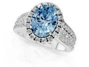 Fancy Blue Oval Cut Diamond Halo Ring Set in Platinum with Pavé Band and Raised Center Setting