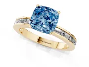 Fancy Blue Cushion Cut Diamond Solitaire Ring Set in Yellow gold with Channel-Set Baguette Band and Prong Setting