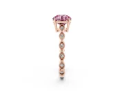 Fancy Pink Round Cut Diamond Solitaire Ring Set in Rose gold with Infinity Twist Pavé Band