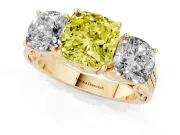 Fancy Yellow Cushion Cut Diamond Three-Stone Ring Set in Yellow gold with Textured Band